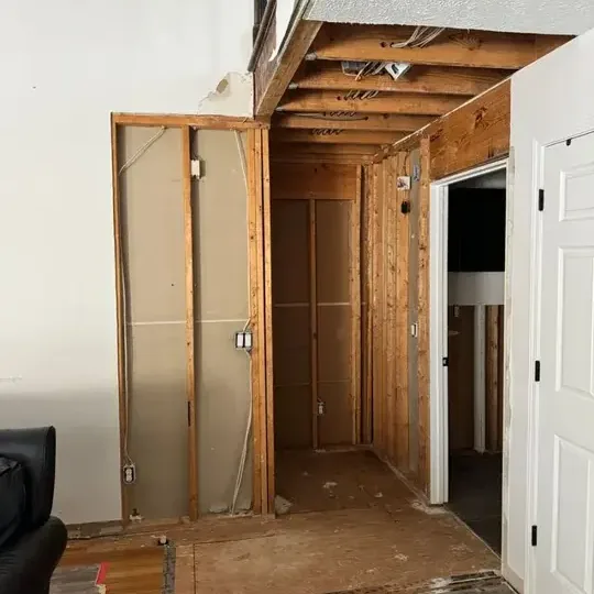 Bare wall framing with the studs left open to air and dry